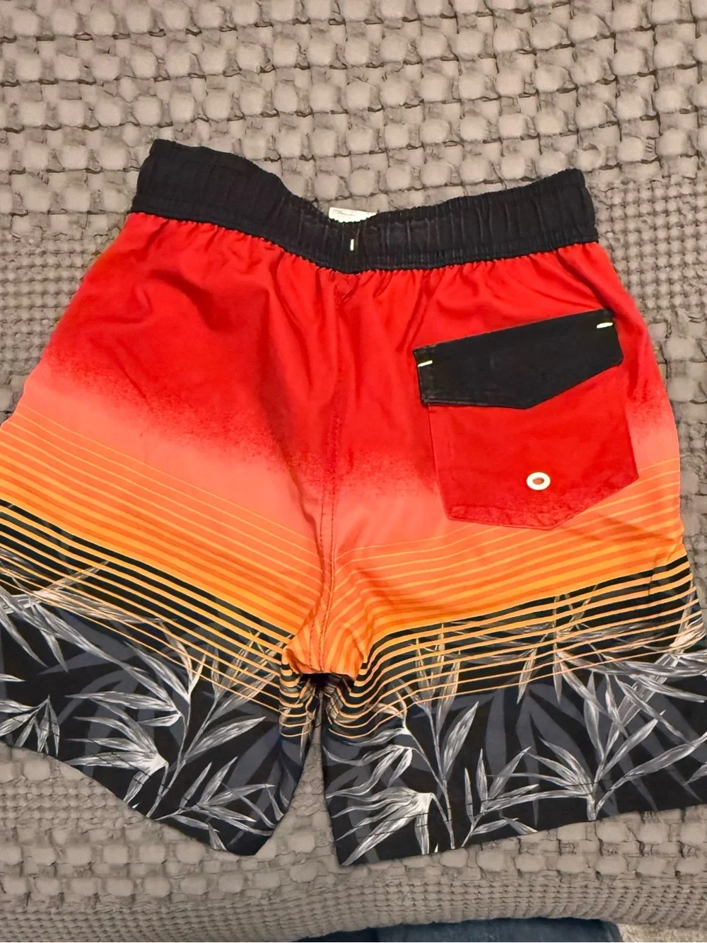Kid’s Red Orange Gradient Swim Trunks with Tropical Print